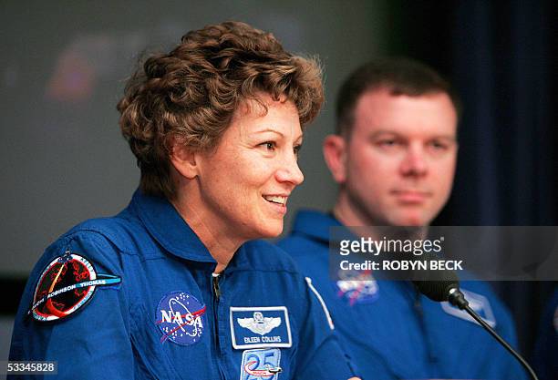 Edwards Air Force Base, UNITED STATES: US space shuttle Discovery Commander Eileen M. Collins and pilot James M. Kelly answer questions during a...