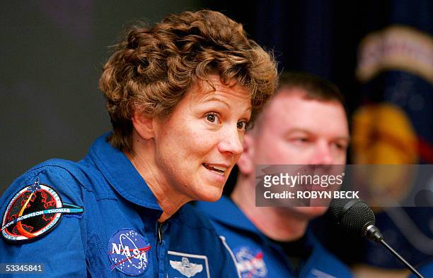 Edwards Air Force Base, UNITED STATES: US space shuttle Discovery Commander Eileen M. Collins and pilot James M. Kelly answer questions at a press...