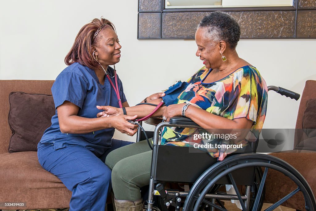 Home Healthcare Worker Assists Senior Woman