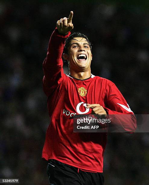 Manchester, UNITED KINGDOM: Manchester United's Cristiano Ronaldo celebrates the third goal against Debreceni in their European Champion's League...