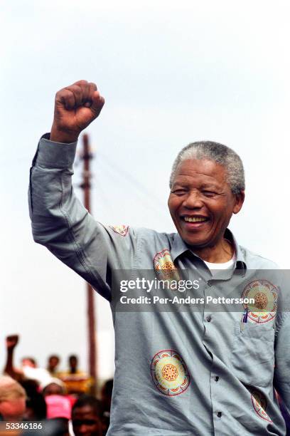 Nelson Mandela acknowledges a crowd of ANC supporters April 21, 1994 in Durban, South Africa. The pre-election rally is just days before the historic...