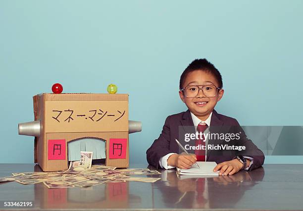 young japanese boy is making money - super excited suit stock pictures, royalty-free photos & images