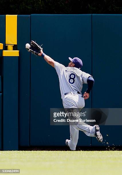 Center fielder Desmond Jennings of the Tampa Bay Rays reaches out and snags a fly ball hit by Victor Martinez of the Detroit Tigers for an out during...