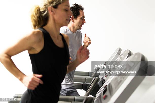 on the running machine - peloton tread stock pictures, royalty-free photos & images