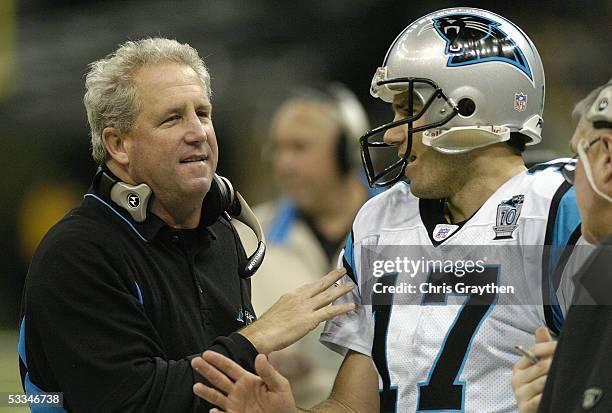 Jake Delhomme of the Carolina Panthers talks to head coach John Fox during the game against the New Orleans Saints at the Louisiana Superdome on...