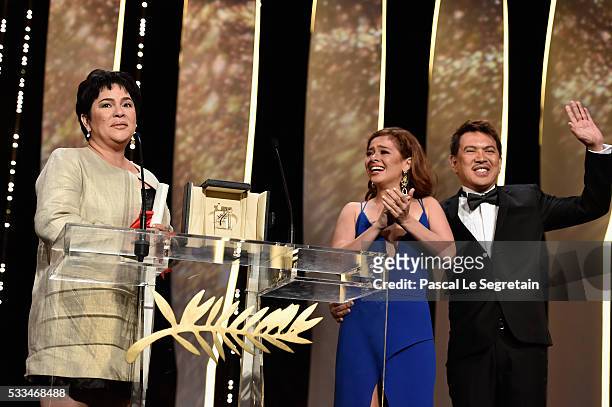 Jaclyn Jose reacts on stage as her daughter Andi Eigenmann and director Brillante Mendoza applaud after being awarded the Best Actress prize during...