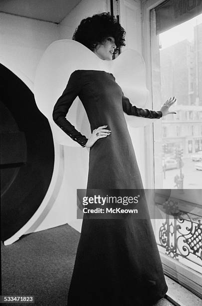 English actress and model Vicki Hodge showing a French evening dress, 13th April 1972.