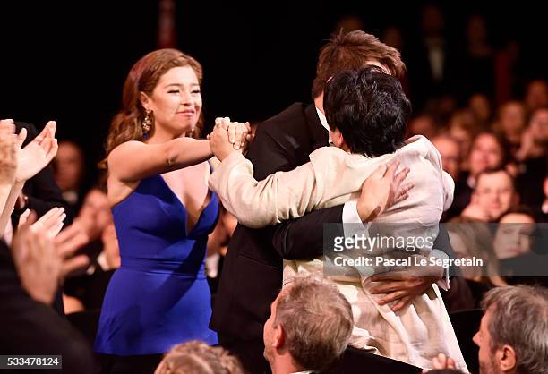 Jaclyn Jose embraces director Brillante Mendoza as her daughter Andi Eigenmann looks on after being awarded the Best Actress prize for the movie...