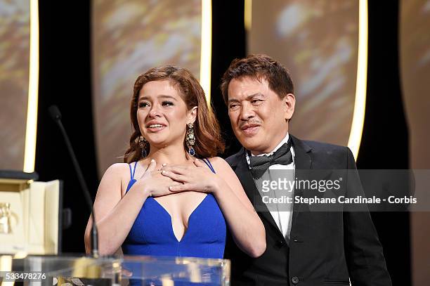 Andi Eigenmann and director Brillante Mendoza applaud after Jaclyn Jose was awarded the Best Actress prize for the movie MaRosa during the closing...