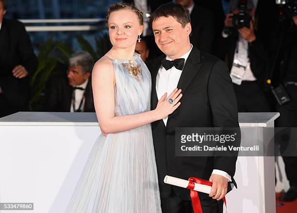 Actress Maria Dragus poses with Romanian director Cristian Mungiu, winner of the Best Director prize for the film 'Graduation ' at the Palme D'Or...