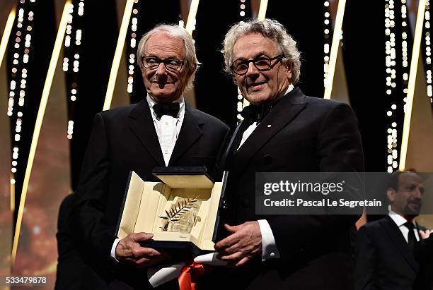 Director Ken Loach poses with director and President of the Jury George Miller after being awarded the Palme d'Or for the movie 'I, Daniel Blake'...