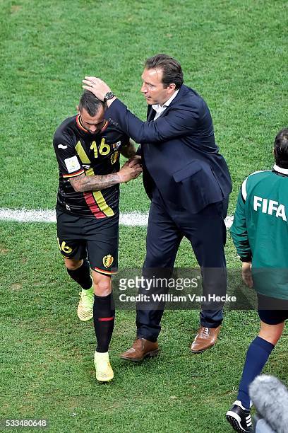 Marc Wilmots, headcoach of Belgium embraces Steven Defour of Belgium who leaves the field after a red card during a FIFA 2014 World Cup Group H match...
