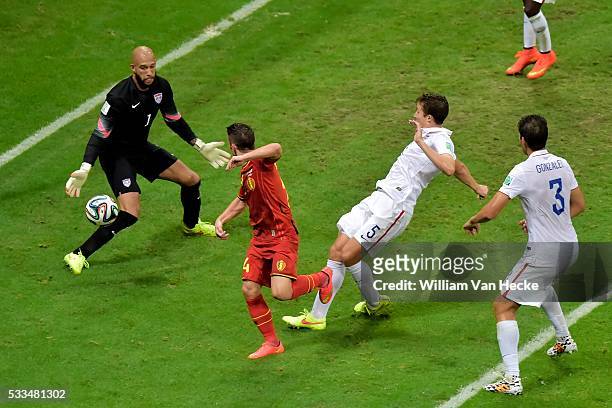Tim Howard of USA stops a ball from Dries Mertens of Belgium during a FIFA 2014 World Cup Round of 16 match between Belgium and USA at the Arena...