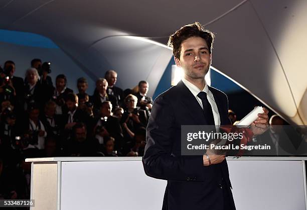 Director Xavier Dolan poses with The Grand Prix for the movie 'Just the end of the world' at the Palme D'Or Winner Photocall during the 69th annual...