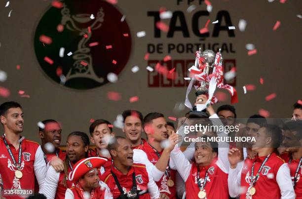 Sporting Braga's players hold the trophy after wining the Portuguese Cup final football match FC Porto vs SC Braga at the Jamor stadium in Oeiras,...