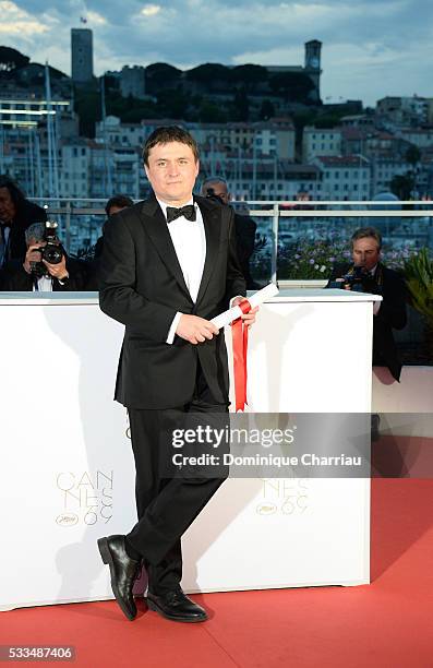 Director Cristian Mungiu poses after receiving the Best Director prize for the movie 'Graduation ' at the Palme D'Or Winner Photocall during the 69th...