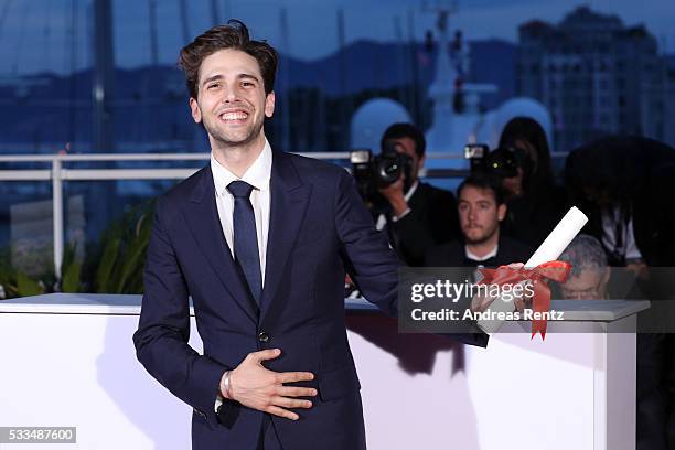 Director Xavier Dolan poses with The Grand Prix for the movie 'Just the end of the world' at the Palme D'Or Winner Photocall during the 69th annual...