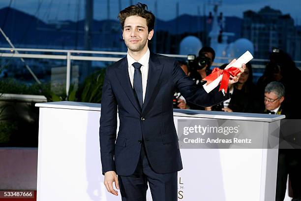 Director Xavier Dolan poses after being awarded The Grand Prix for the movie 'Just the end of the world' during the Palme D'Or Winner Photocall...