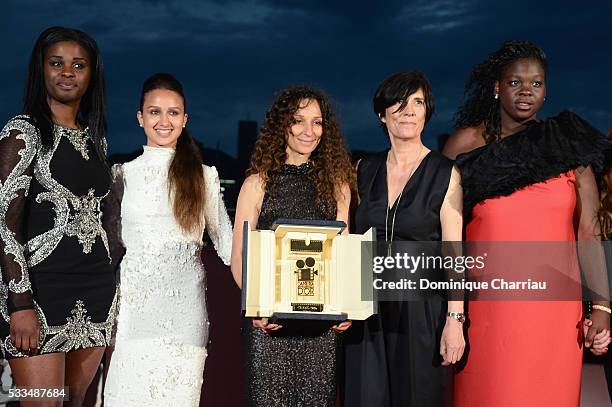 French Moroccan director Houda Benyamina poses with the Camera d'Or next to actresses Jisca Kalvanda , Oulaya Amamra and Deborah Lukumuena at the...