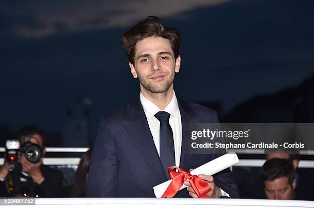 Director Xavier Dolan poses after being awarded The Grand Prix for the movie 'Just the end of the world' during the Palme D'Or Winner Photocall...