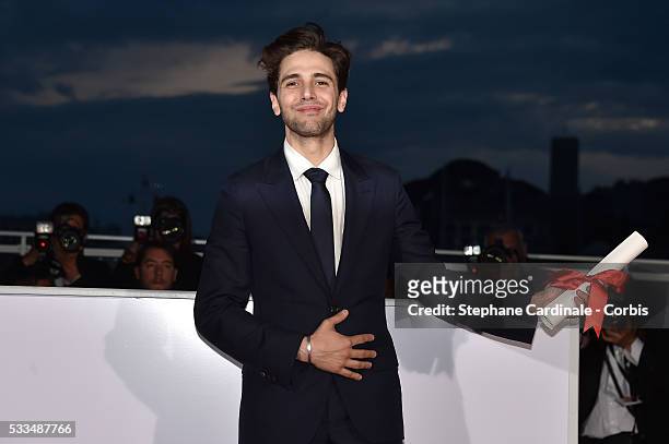 Director Xavier Dolan poses after being awarded The Grand Prix for the movie 'Just the end of the world' during the Palme D'Or Winner Photocall...