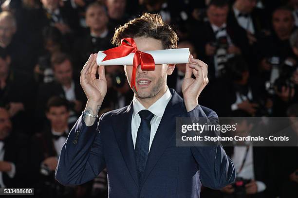 Director Xavier Dolan poses after being awarded The Grand Prix for the movie 'Just the end of the world' during the Palme D'Or Winner Photocall...