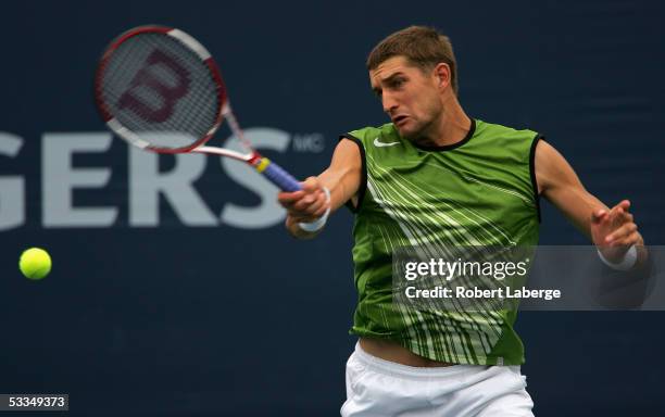 Max Mirnyi of Belarus returns to Greg Rusedski of Great Britain in their second round match at the ATP Rogers Cup Masters tennis tournament on August...