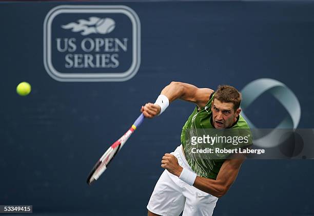 Max Mirnyi of Belarus serves to Greg Rusedski of Great Britain in their second round match at the ATP Rogers Cup Masters tennis tournament on August...