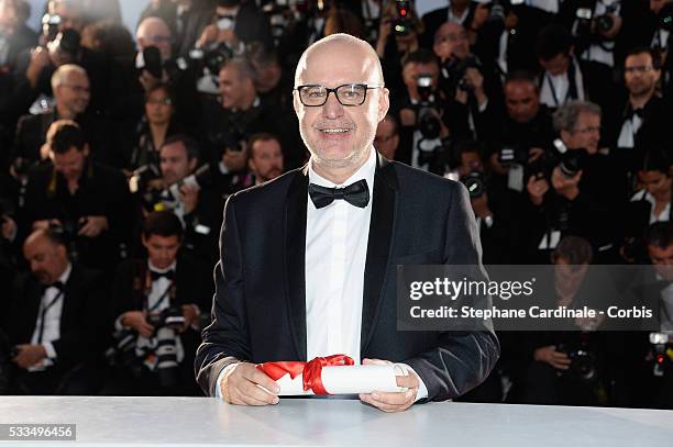 Spanish director Juanjo Gimenez poses with the Palme d'Or award for Best Short Film for 'Timecode' at the Palme D'Or Winner Photocall during the 69th...