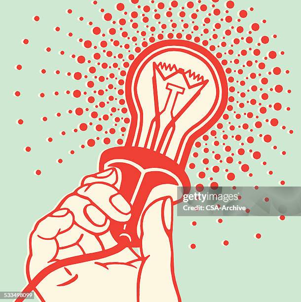 hand holding lightbulb - electrician stock illustrations