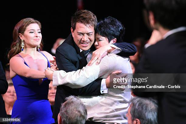 Actress Jaclyn Jose hugs director Brillante Mendoza next to actress Andi Eigenmann and after being awarded with the Best Actress prize during the...