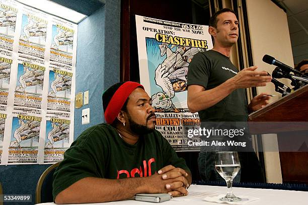 Musician Eric Hilton of Thievery Corporation speaks as musician Head Roc listens during a news conference on Operation Ceasefire August 10, 2005 in...