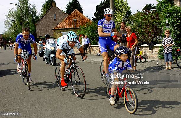 Cycling - 2004 Gistel Criterium. Johan Museeuw in the race paying tribute to him as he is retiring as a professional, with his son Stefano and fellow...