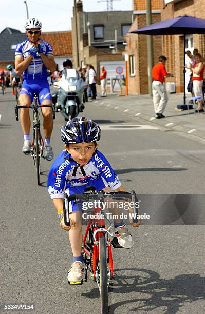 Cycling - 2004 Gistel Criterium. Johan Museeuw in the race paying tribute to him as he is retiring as a professional, with his son Stefano. Cyclisme...