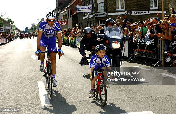 Cycling - 2004 Gistel Criterium. Johan Museeuw in the race paying tribute to him as he is retiring as a professional, with his son Stefano. Cyclisme...