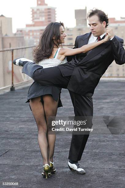 Javier Garcia and Moira Sauvane dance the tango on a Manhattan rooftop June 17, 2005 in New York City. Javier Garcia, an Argentinian-American and a...