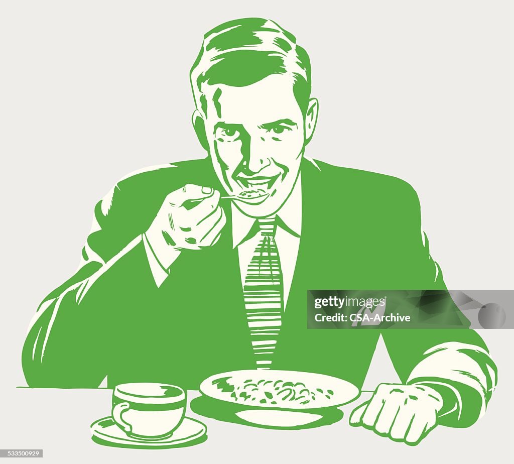 Homem comer o pequeno-almoço