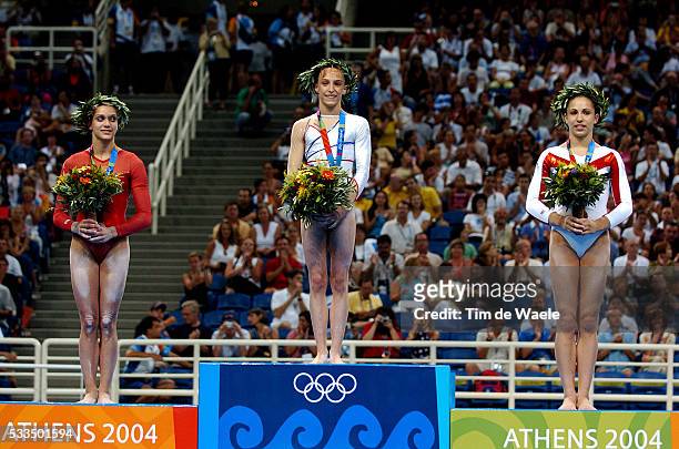 Emilie Lepennec takes center stage on the podium during the award ceremony with her gold medal alongside Terin Humphrey who won silver and Courtney...