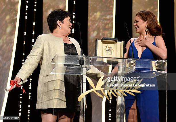 Actress Jaclyn Jose delivers a speech next to actress Andi Eigenmann after being awarded with the Best Actress prize during the Closing Ceremony at...