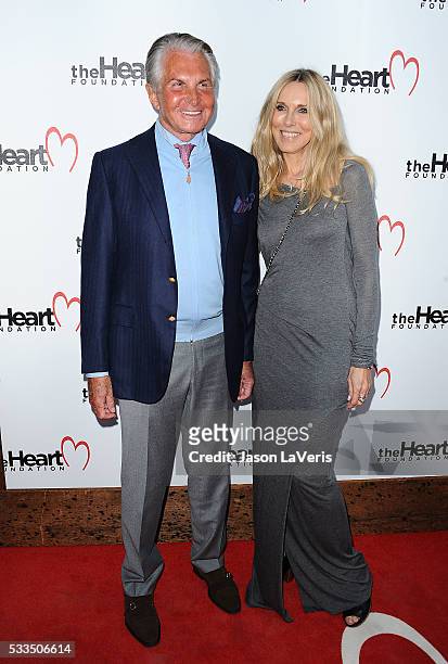 Actor George Hamilton and Alana Stewart attend The Heart Foundation event at Ron Burkle's Green Acres Estate on May 21, 2016 in Beverly Hills,...