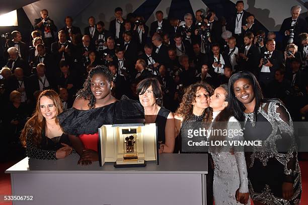 French Moroccan director Houda Benyamina poses with French director and President of the Camera d'Or Jury Catherine Corsini and the cast of her film...
