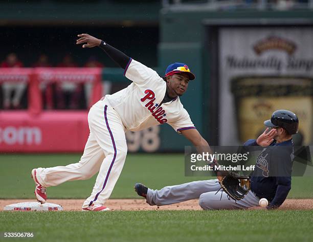 Ender Inciarte of the Atlanta Braves slides past Maikel Franco of the Philadelphia Phillies to steal second base in the top of the eighth inning at...