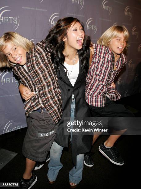 Actors Dylan Sprouse, Brenda Song and Cole Sprouse pose as they arrive at the Hollywood Radio and Television Society presents "Kids Day 2005" at the...