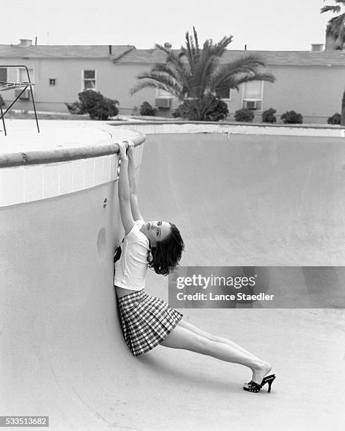 Juliette Lewis Hanging from Swimming Pool Edge