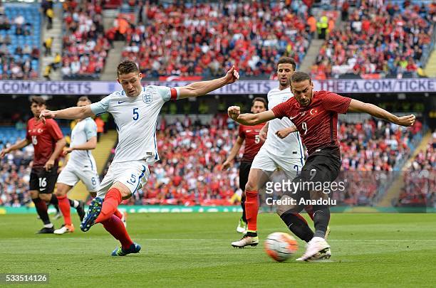 Turkey's Cenk Tosun in action against England's Gary Cahill during an international friendly match between England and Turkey at Etihad Stadium on...