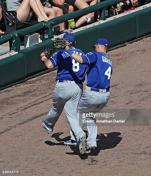 Alex Gordon of the Kansas City Royals and Mike Moustakas collide going for a foul ball against the Chicago White Sox at U.S. Cellular Field on May...