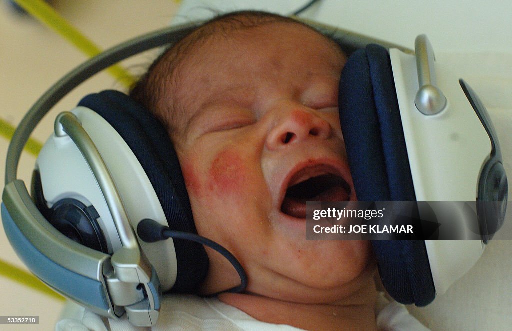 One-day-old  baby Tomas listens to music