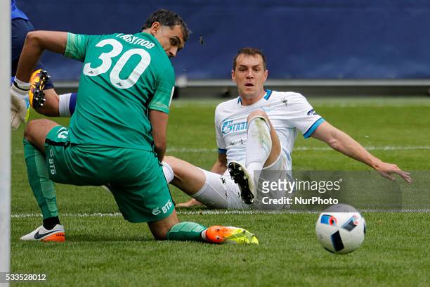 Vladimir Gabulov of FC Dynamo Moscow and Artem Dzyuba of FC Zenit St. Petersburg look on the ball during the Russian Football Premier League match...