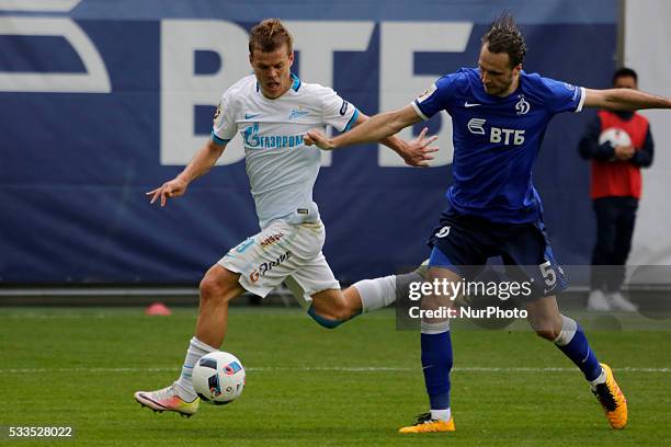 Aleksandr Kokorin of FC Zenit St. Petersburg and Vitali Dyakov of FC Dynamo Moscow vie for the ball during the Russian Football Premier League match...