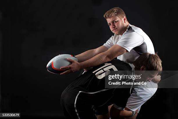 opposition rugby - rugby tackling stock pictures, royalty-free photos & images